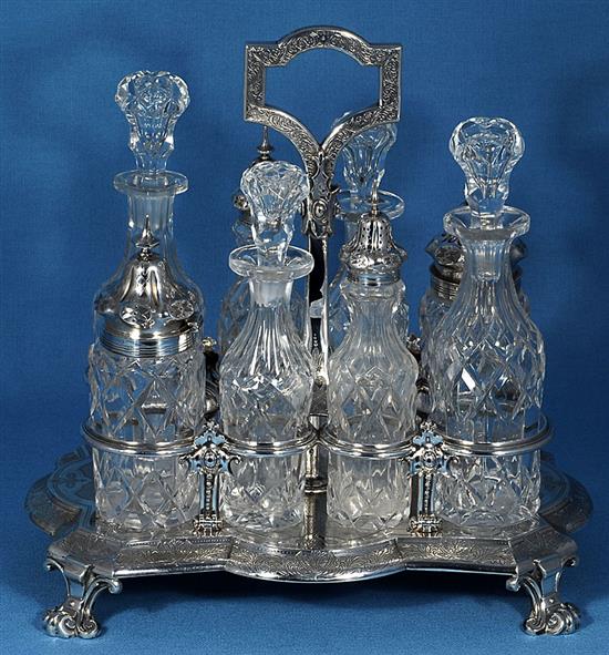 A Victorian silver eight bottle cruet stand and eight original bottles, by Walter & John Barnard, height 280mm, weight 40oz